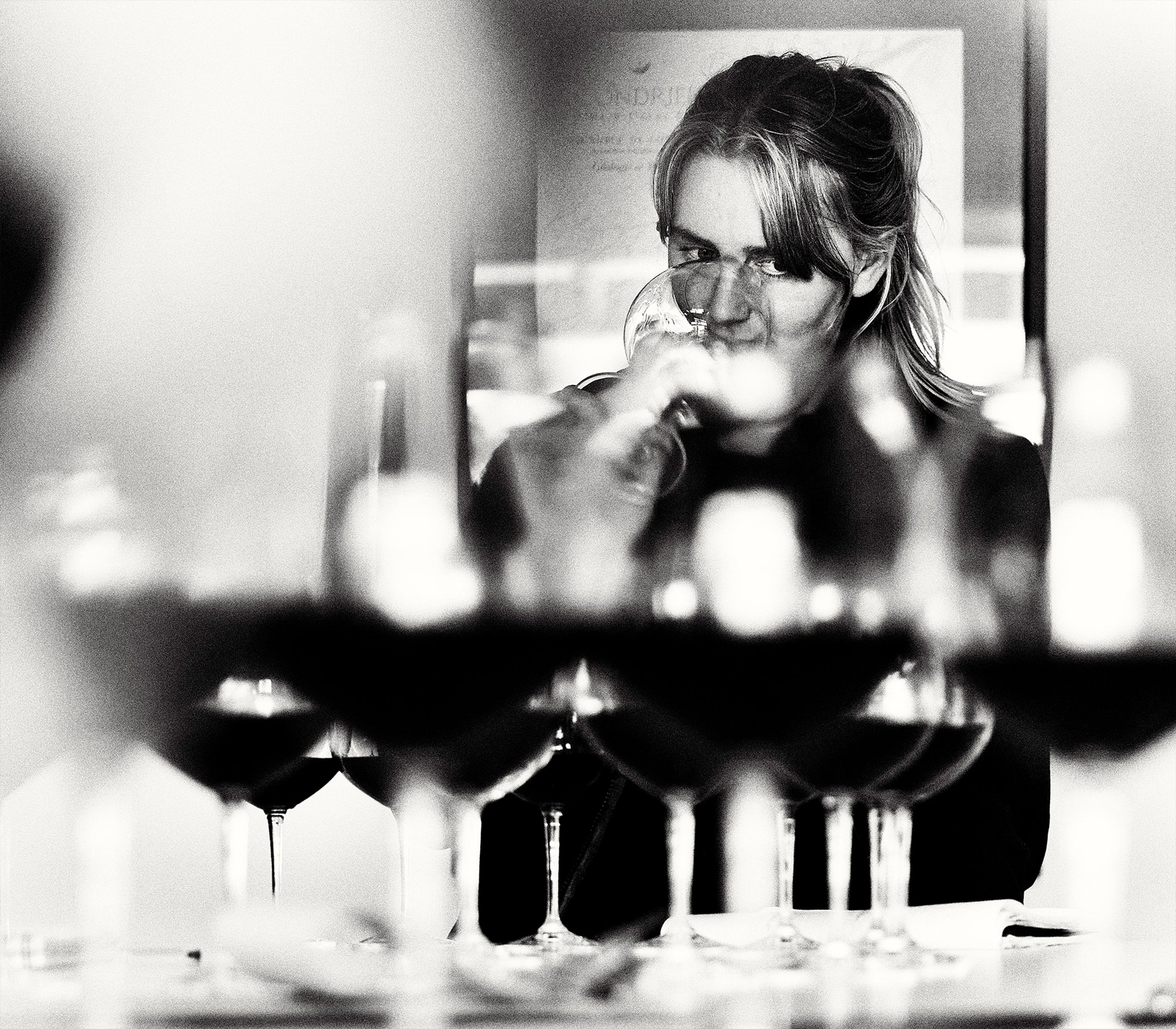 Woman tasting wine