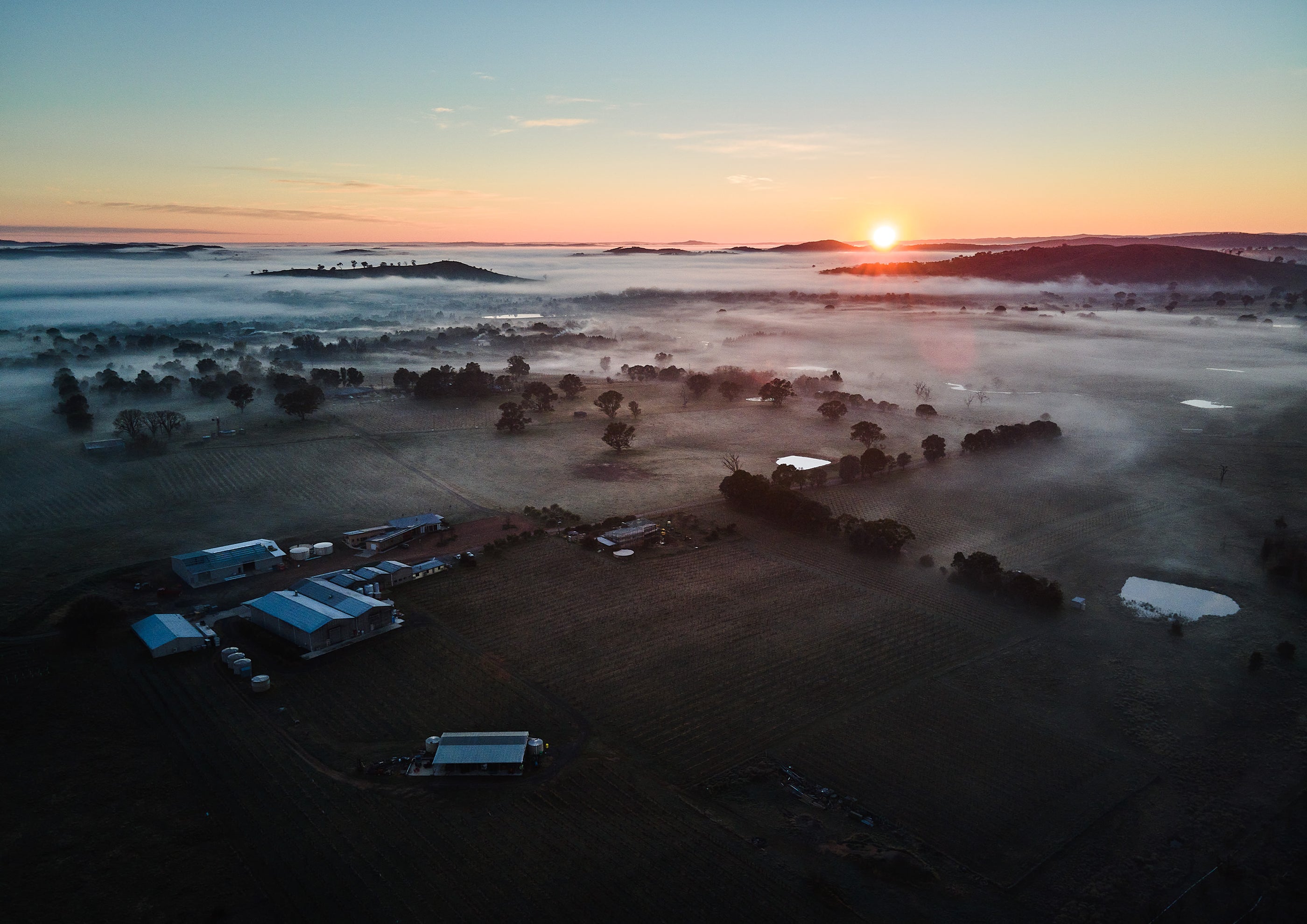 Drone shot of of misty Clonakilla at sunrise